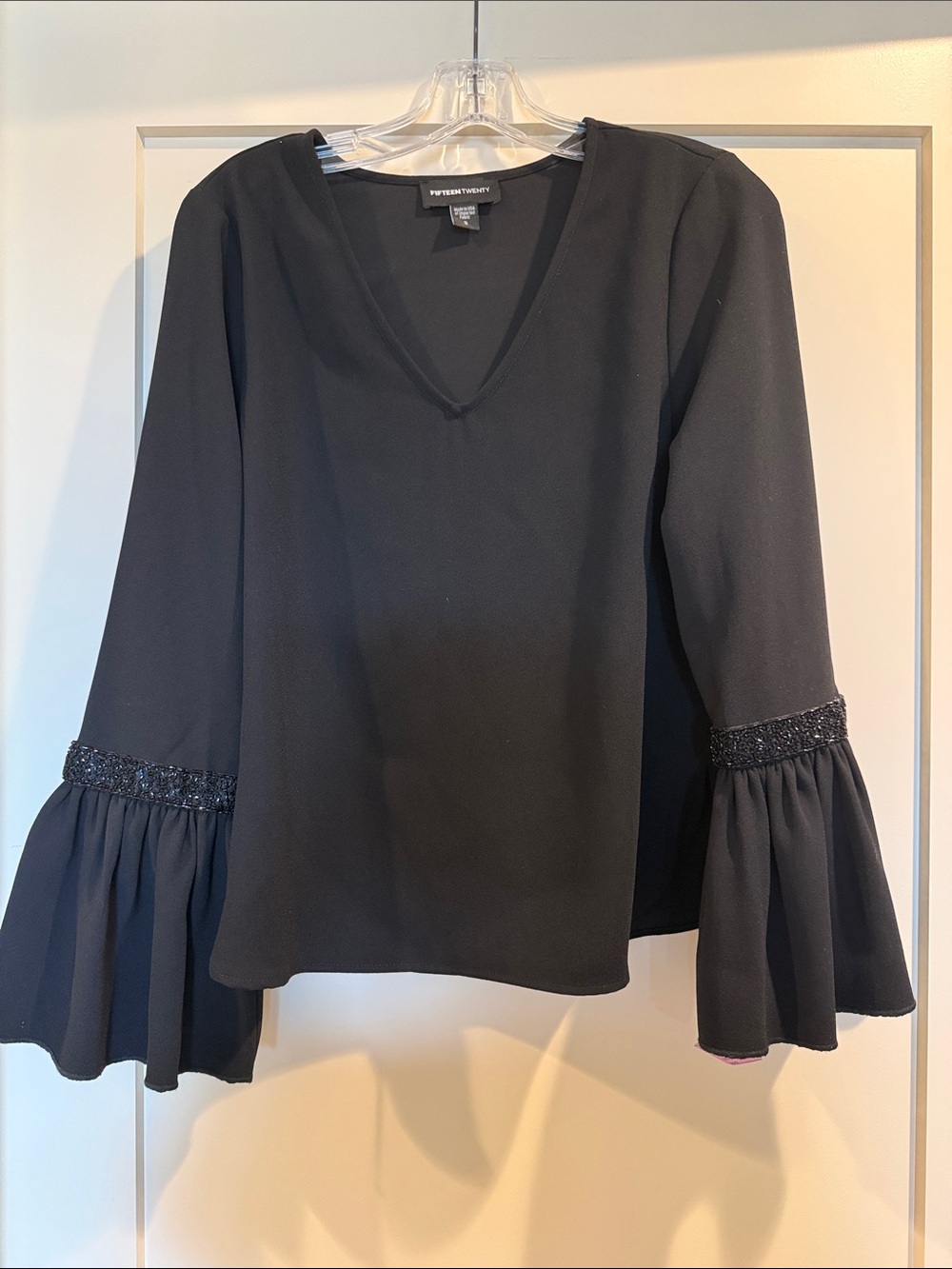 Worn once. FifteenTwenty black crepe v neck top with sleeve embellishment